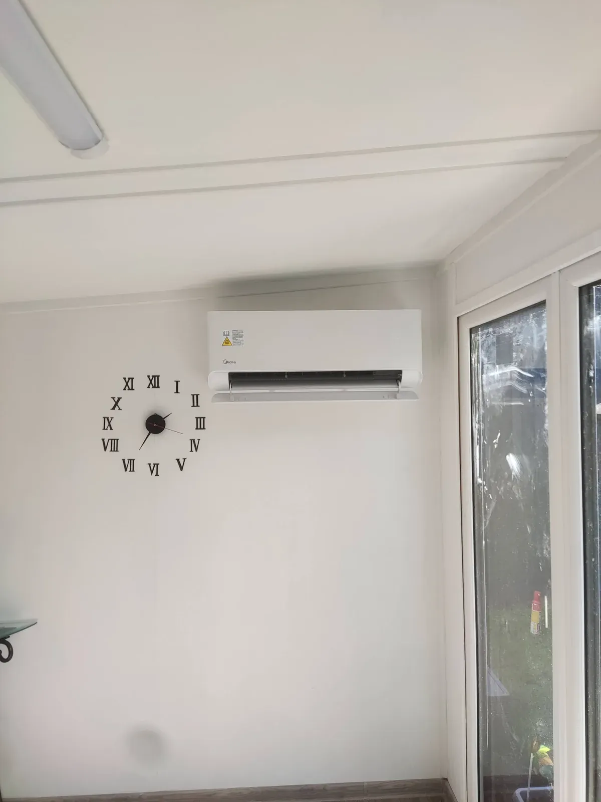 Wall mounted air conditioning indoor unit installed in a garden room