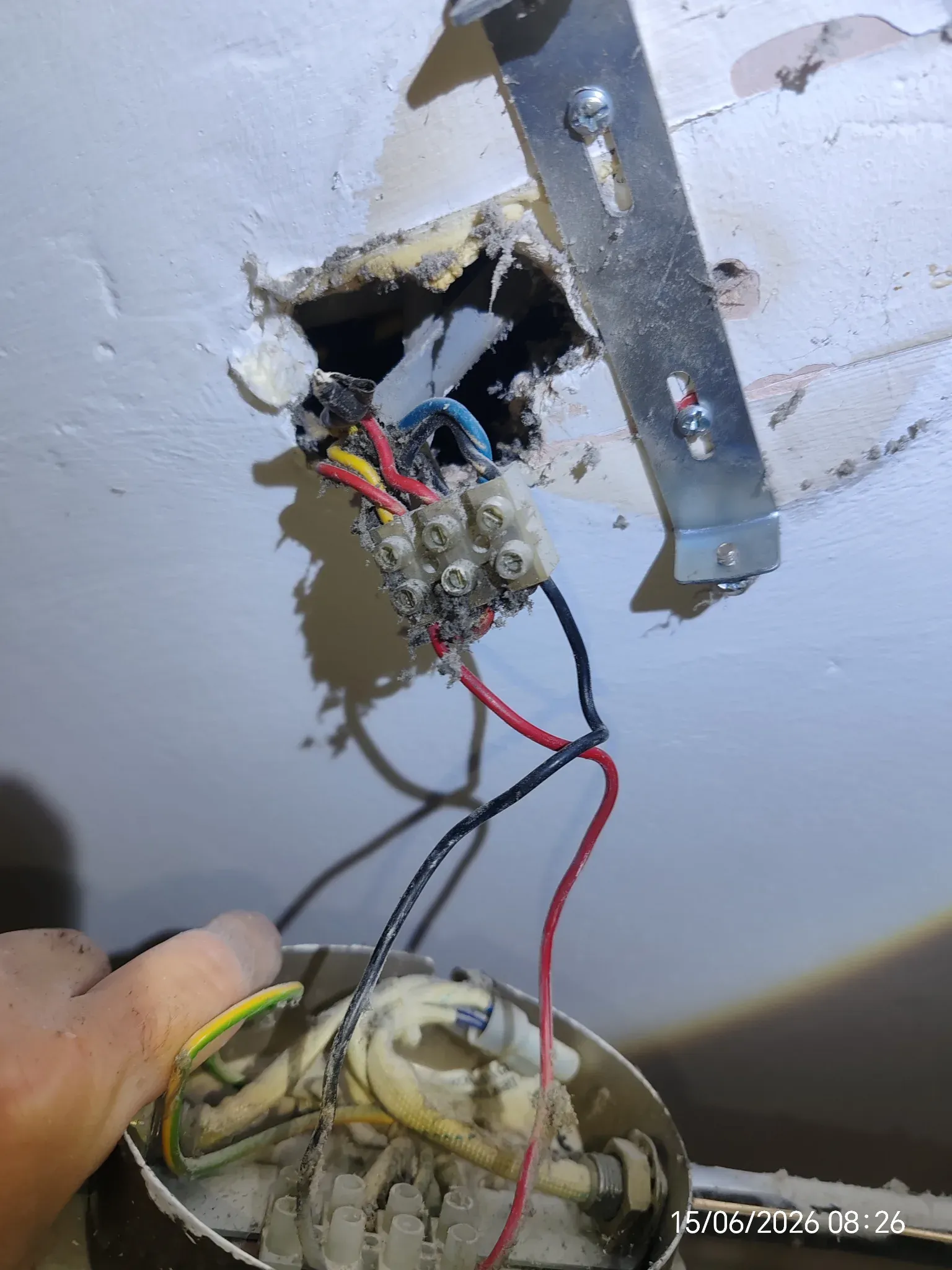 Exposed terminal connections at a light fitting found during EICR inspection